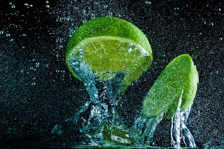 fruit splashing in the waterの写真素材