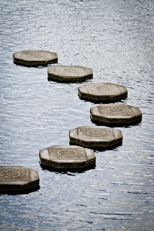 stone steps floating on the water, Tirtagangga water palace, Bali, Indonesiaの写真素材