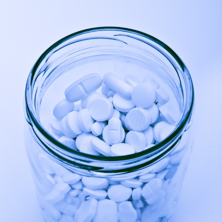 pills and tablets in glass containerの写真素材