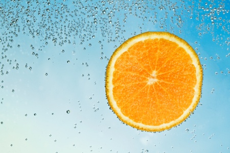 mandarine coverd with bubbles isolatedの写真素材