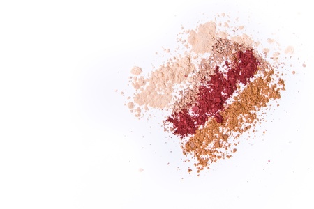 makeup powder in three colors on white backgroundの写真素材