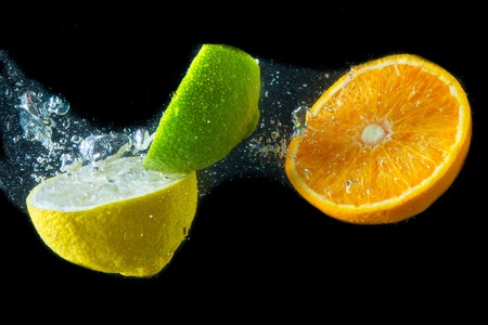 fruit splashing in the waterの写真素材