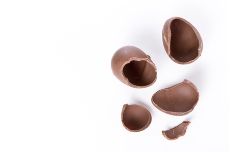 cracked chocolate egg isolated on white
