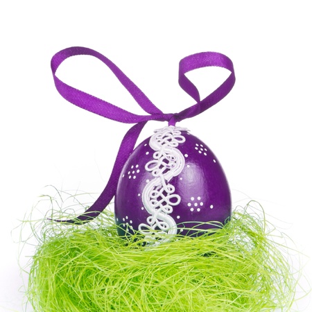 decorated easter egg in the grassの写真素材