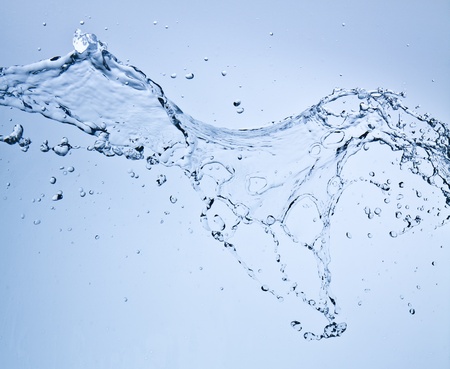 water splash close up shot on blue backgroundの写真素材
