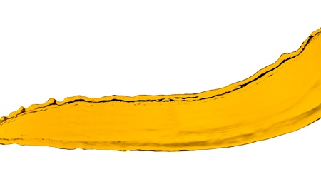 orange juice splash isolated on white backgroundの写真素材