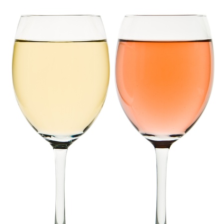 two wine glasses with white and rose wineの写真素材