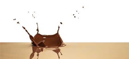 chocolate splash closeup isolated on white backgroundの写真素材