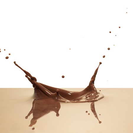 chocolate splash closeup isolated on white backgroundの写真素材