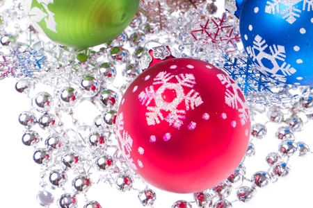 christmas balls with tinsel isolated on white backgroundの写真素材