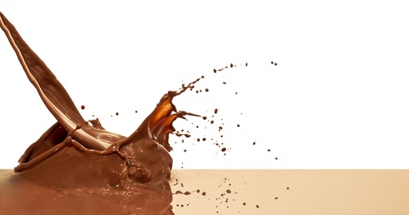 chocolate splash closeup isolated on white backgroundの写真素材