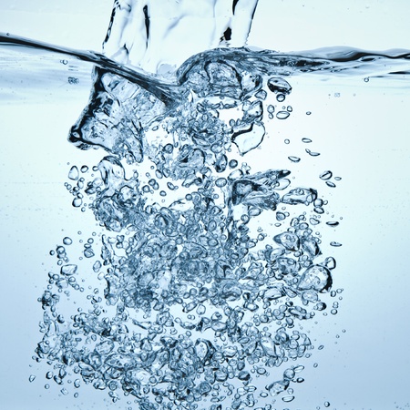 closeup of bubbles in blue waterの写真素材