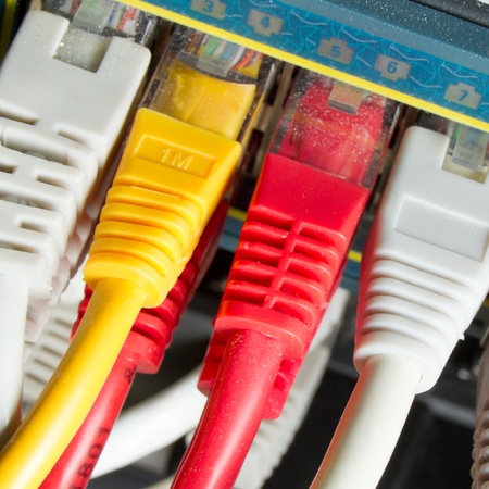 close up of network cables connected to switchの写真素材