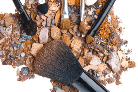 crushed eyeshadows with set of brushes isolated on white backgroundの写真素材