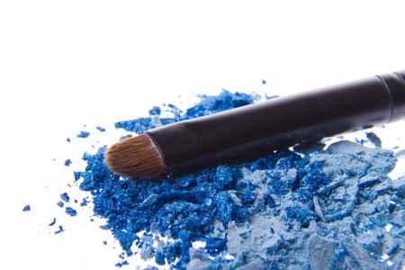 crushed eyeshadows with brush isolated on white backgroundの写真素材