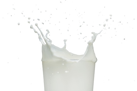 milk splashing from the glassの写真素材