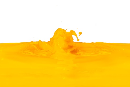 yellow paint splashing isolated on whiteの写真素材