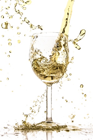 white wine splash isolated on whiteの写真素材