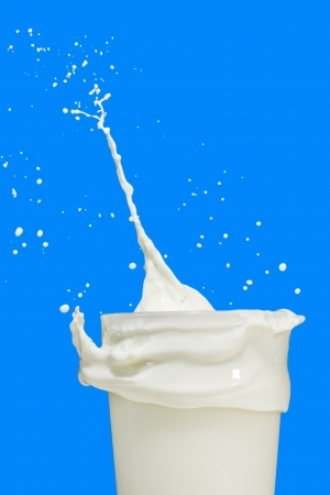 milk splashing from the glassの写真素材