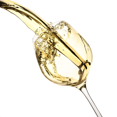 white wine splash isolated on whiteの写真素材