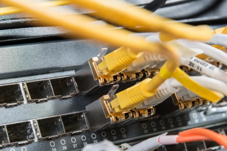 close-up of network hub and ethernet cables