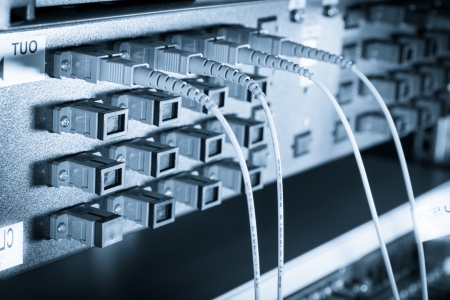 server with fiber optic  cables in data centerの写真素材