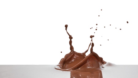 chocolate splash closeup isolated on white backgroundの写真素材