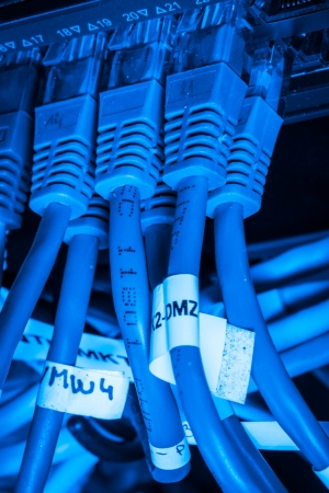 close-up of network hub and ethernet cablesの写真素材