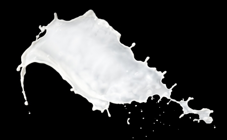 milk splash isolated on black backgroundの写真素材