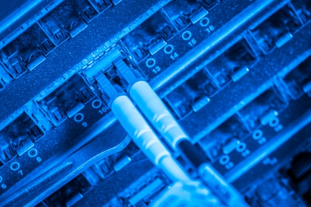 server with fiber optic  cables in data centerの写真素材