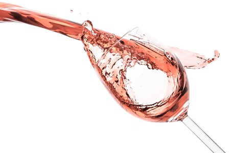 rose wine splashing on white backgroundの写真素材