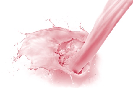 pouring strawberry milk, isolated on white backgroundの写真素材
