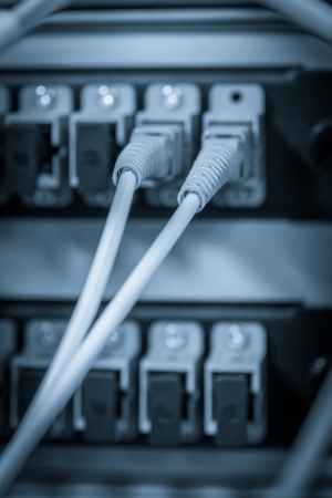 server with fiber optic  cables in data centerの写真素材