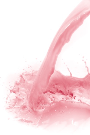 pouring strawberry milk, isolated on white backgroundの写真素材