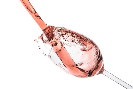 rose wine splashing on white backgroundの写真素材