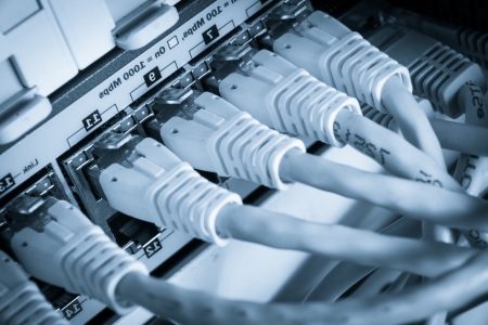 close-up of network hub and ethernet cablesの写真素材