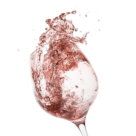 rose wine splashing on white backgroundの写真素材