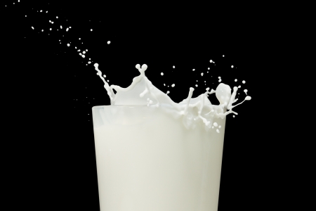 milk splashing from the glassの写真素材