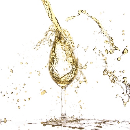 white wine splash isolated on whiteの写真素材