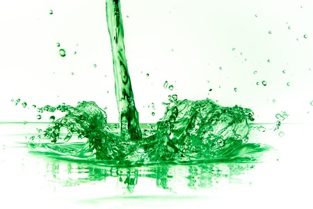 green liquid splash on white backgroundの写真素材