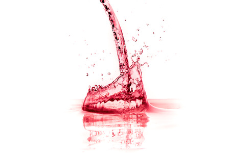 red wine splash isolated on white の写真素材