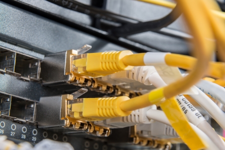 close-up of network hub and ethernet cables