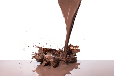 splashing hot chocolate, isolated on white backgroundの写真素材