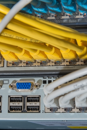 network cables connected to switch - closeup of data center hardwareの写真素材