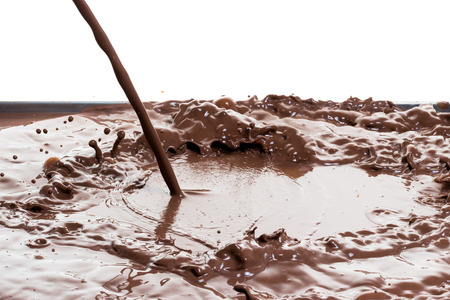 splashing hot chocolate, isolated on whiteの写真素材