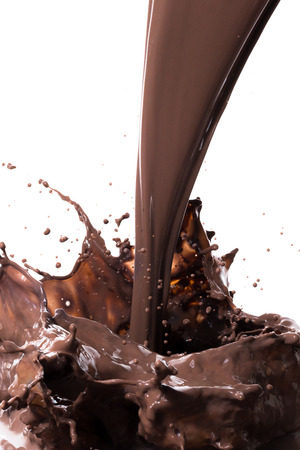 splashing hot chocolate, isolated on white backgroundの写真素材