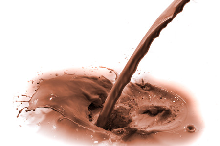 pouring chocolate drink, isolated on white backgroundの写真素材