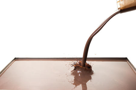 splashing hot chocolate, isolated on white backgroundの写真素材