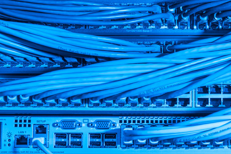 network cables connected to switch - closeup of data center hardware