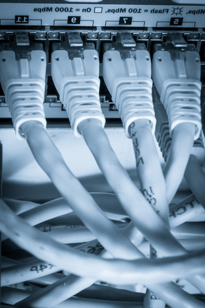 close-up of network hub and cablesの写真素材